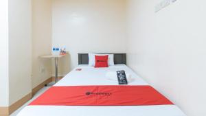 Letto o letti in una camera di RedDoorz at Isabelita Hotel Tuguegarao City