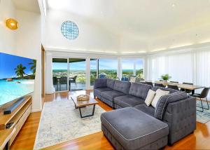 a living room with a couch and a table at Pacific Vista in Coffs Harbour