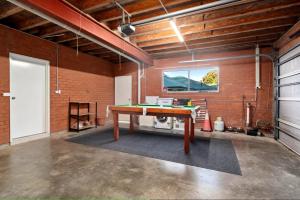 a room with a ping pong table in it at Pacific Vista in Coffs Harbour