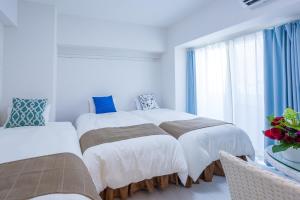Living Inn Asahibashiekimae Anex客房内的一张或多张床位