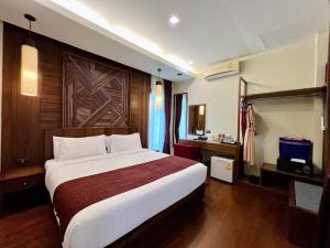 En eller flere senger på et rom på Aonang Phu Pi Maan Resort & Spa