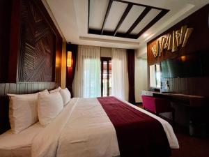 En eller flere senger på et rom på Aonang Phu Pi Maan Resort & Spa