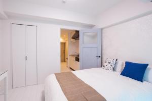 Living Inn Asahibashiekimae Anex客房内的一张或多张床位