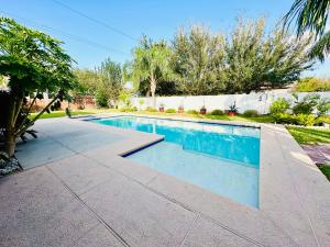 a swimming pool in a yard with a house at Casa Colibrí in Harlingen