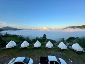 a group of tents on a hill near a lake at Heaven Khaokho (เฮฟเว่น) in Khao Kho