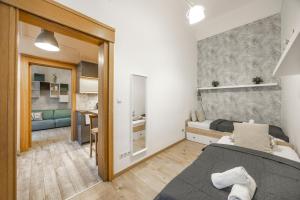Posteľ alebo postele v izbe v ubytovaní Deluxe n' Cozy City Center 2BEDRM Suite