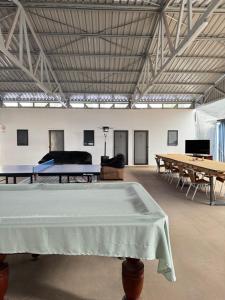 a large room with ping pong tables in it at Red Emu Motel in Perenjori