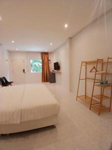 a bedroom with a bed and a ladder in it at ฮัก ณ หนองคายโคซี่วิลล์ Hug Na Nongkhai Cozy Ville in Nong Khai