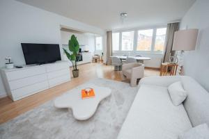 Televízia a/alebo spoločenská miestnosť v ubytovaní Designer-Apartment zum Wohlfühlen