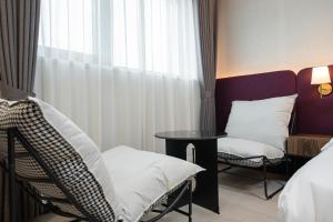 Postel nebo postele na pokoji v ubytování Hound hotel gunsan