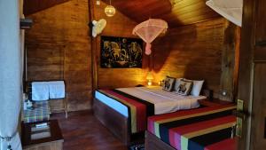 Postel nebo postele na pokoji v ubytování Sigiriya Rock View Tree house