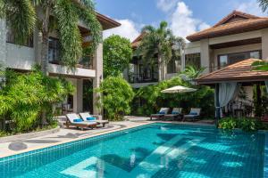 a swimming pool in front of a villa at 2 Secluded Villas Private Resort in Nathon Bay