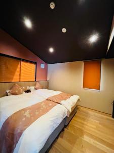 a bedroom with a large bed in a room at Tofukuji Tsutenan東福寺通天庵 in Kyoto +20 photos