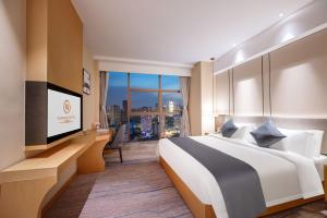 Chengdu Yunhao High-altitude Hotel客房内的一张或多张床位