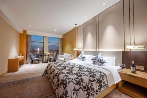 Chengdu Yunhao High-altitude Hotel客房内的一张或多张床位