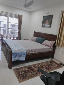 a bedroom with a bed and a window at Sivarama garden resort 5star stay swimming pool 2BHK dorathota to bheemunipatam beach road in Visakhapatnam