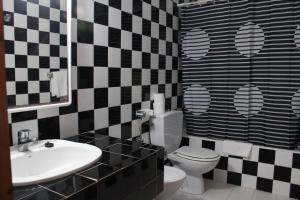 Ett badrum på Es Grop Apartments
