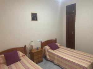 Ένα ή περισσότερα κρεβάτια σε δωμάτιο στο Casa RACABEL