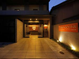 an entrance to a building with a sign on it at Smart Place Inn Kyoto Shijo Omiya Station in Kyoto +27 photos