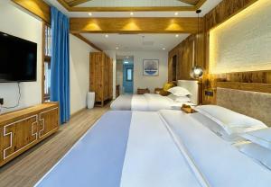 夕露古城中心店 XILU INN NANXI - Ancient City Center Branch客房内的一张或多张床位