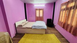 Una cama o camas en una habitación de Maa Buu Chhen