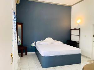 Postel nebo postele na pokoji v ubytování Hotel Marilyn