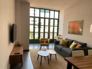 אזור ישיבה ב-Casa Luxe Suites Barcelona