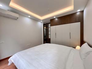 Letto o letti in una camera di NINE HOUSING 49 Linh Lang