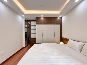 Letto o letti in una camera di NINE HOUSING 49 Linh Lang