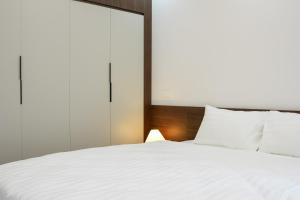 Letto o letti in una camera di NINE HOUSING 49 Linh Lang