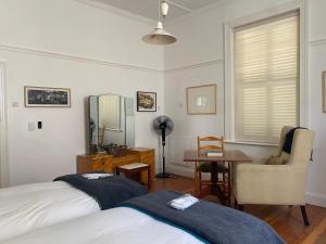 Ένα ή περισσότερα κρεβάτια σε δωμάτιο στο Sleep at MAPSA Richmond - House