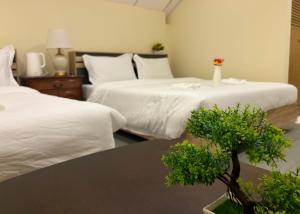 Apamet Hotel Sukhumvit 55客房内的一张或多张床位