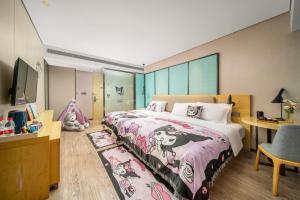 Krevet ili kreveti u jedinici u okviru objekta Echarm Hotel Kunming Changshui International Airport