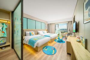 Krevet ili kreveti u jedinici u okviru objekta Echarm Hotel Kunming Changshui International Airport