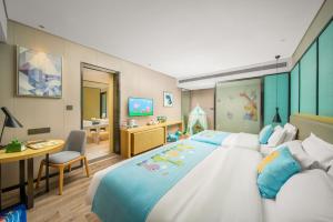 Krevet ili kreveti u jedinici u okviru objekta Echarm Hotel Kunming Changshui International Airport