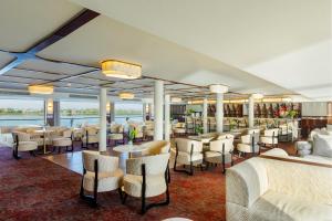 a restaurant on a cruise ship with tables and chairs at Tamr Nile Cruise - 04 Nights Every Monday from Luxor - 03 Nights Every Friday from Aswan in Luxor