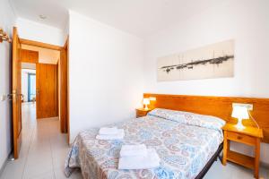 Postel nebo postele na pokoji v ubytování C'an Vidal apto Formentera