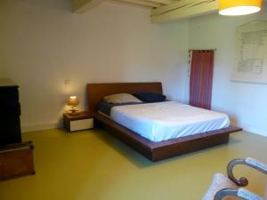 a bedroom with a bed in a room at Ferme de la Rose in Rosans