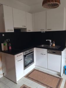 Kuchyň nebo kuchyňský kout v ubytování Nina Apartments