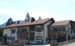 a large white building with a porch and balcony at Gästehaus Wolfgang Weitsee -2- in Ruhpolding +9 photos