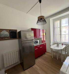 Kuchyň nebo kuchyňský kout v ubytování Le Piton - Appartements + 36 fotografií