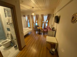 a room with a bathroom with a sink and a toilet at Konak Akaretler Suit in Istanbul +40 photos