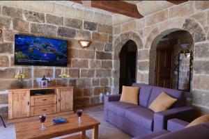 TV a/nebo společenská místnost v ubytování Ta' Nikola Farmhouse, Xaghra