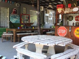 a wooden picnic table in a restaurant with a stop sign at Eagle's Nest in Barberton
