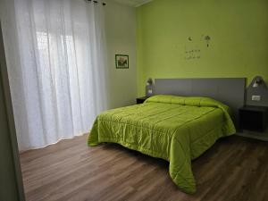 Postel nebo postele na pokoji v ubytování L'arancio B&B