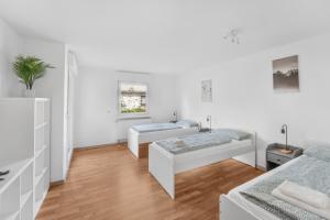 Postel nebo postele na pokoji v ubytování City Apartments- Work & Stay nahe Hannover