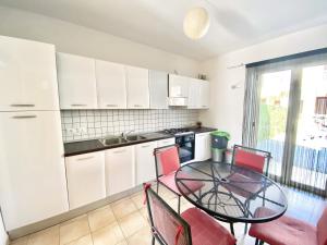 Kuchyň nebo kuchyňský kout v ubytování Isca Calabretta Apartments M2