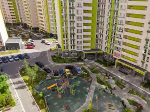 an aerial view of a playground in a city at Petrovdom 129-179-191-131 in RC Nivki Park Space Meets Comfort in Kyiv