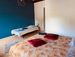 a room with two beds in a room at La Mariefacture comme un charme in Haute-Vigneulles