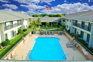 an image of a swimming pool at a house at Ashmore Inn and Suites Lubbock in Lubbock